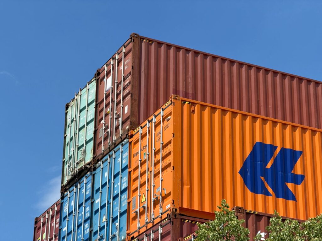 Why Market Readiness Matters More Than Market Opportunity Colorful shipping containers stacked in an outdoor storage area in Germany.